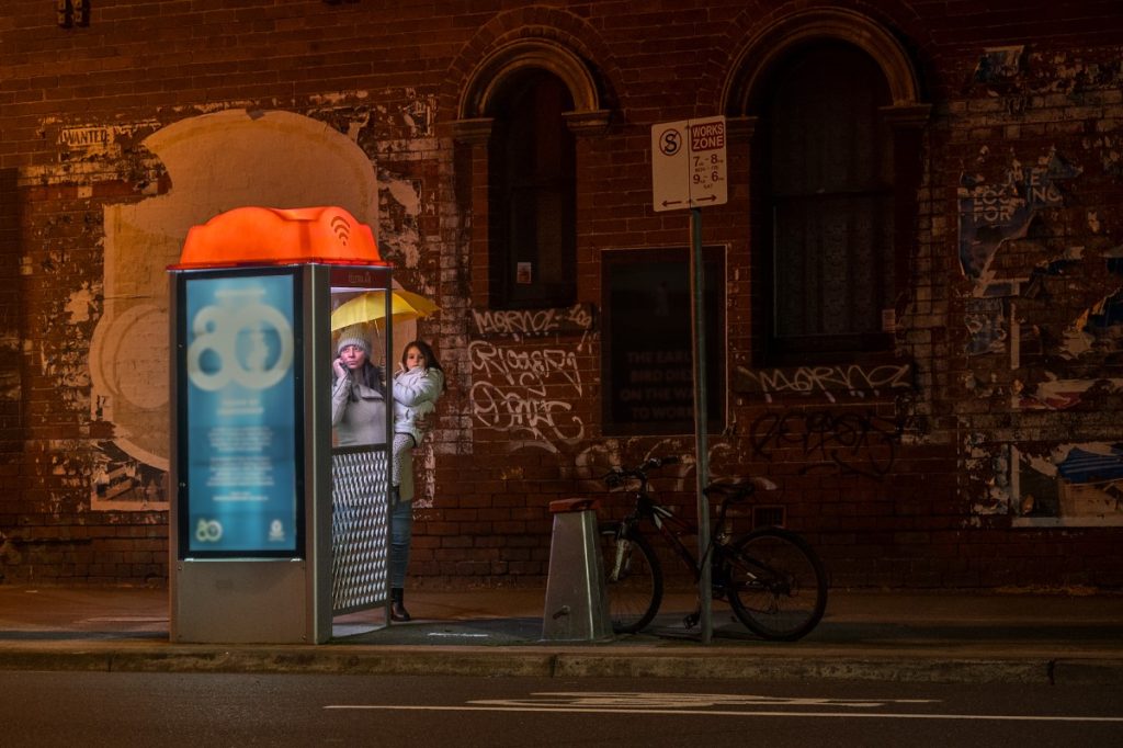 Mother using Telstra phonebooth